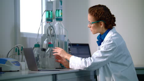 Scientist-working-with-equipment-in-modern-lab.-Scientific-research